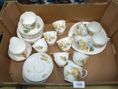 A Czecho-slovakian china part Teaset with yellow roses and violets and a Royal Imperial Teaset with