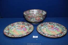 A Chinese porcelain punchbowl enamelled with garden scenes within a floral border with 2 matching