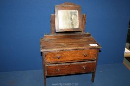 An Oak child's dressing table, circa 1920, 17 1/2" tall overall.