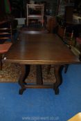 A contemporary darkwood extending Dining Table,