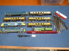 A quantity of Hornby Railway carriages, a Lima Eagle 50043 locomotive,