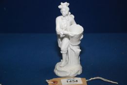 A continental white porcelain figure of a gentleman, probably Vienna, 18th c.