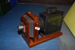 An Edwardian extending Magic Lantern Projector 24" long x 9" wide x 11" tall.