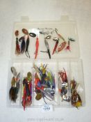 A Fishing Tackle box and contents of a good number of spinners (hair,