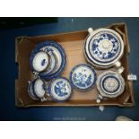 A quantity of Booths 'Real Old Willow' pattern dinnerware including soup coups and saucers,
