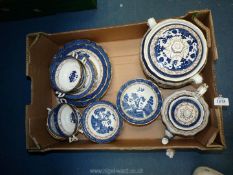 A quantity of Booths 'Real Old Willow' pattern dinnerware including soup coups and saucers,