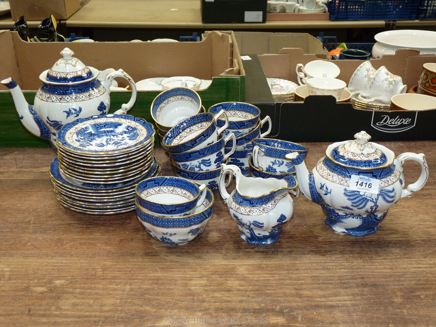 A Booths 'Real Old Willow' part Teaset: twelve cups, ten saucers, eight tea plates, teapot, jug,