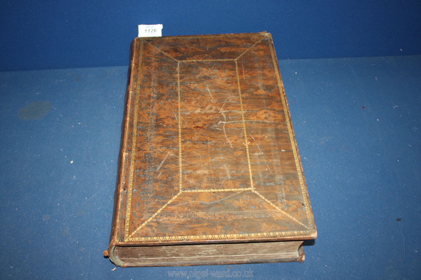 A large old brown leather Welsh Bible.