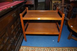 A Teak two tier tea Trolley, 28'' x 18'' x 25'' high.