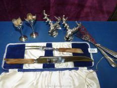 A Sheffield carving set in presentation box, an Edwardian EP pair of fish servers,