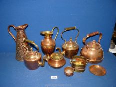 A quantity of brass and copper to include jug with scale design, kettles, jug, lidded pot, etc.