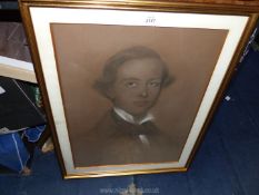 A framed and mounted Charcoal Portrait of a young gentleman 21 1/4" x 27".