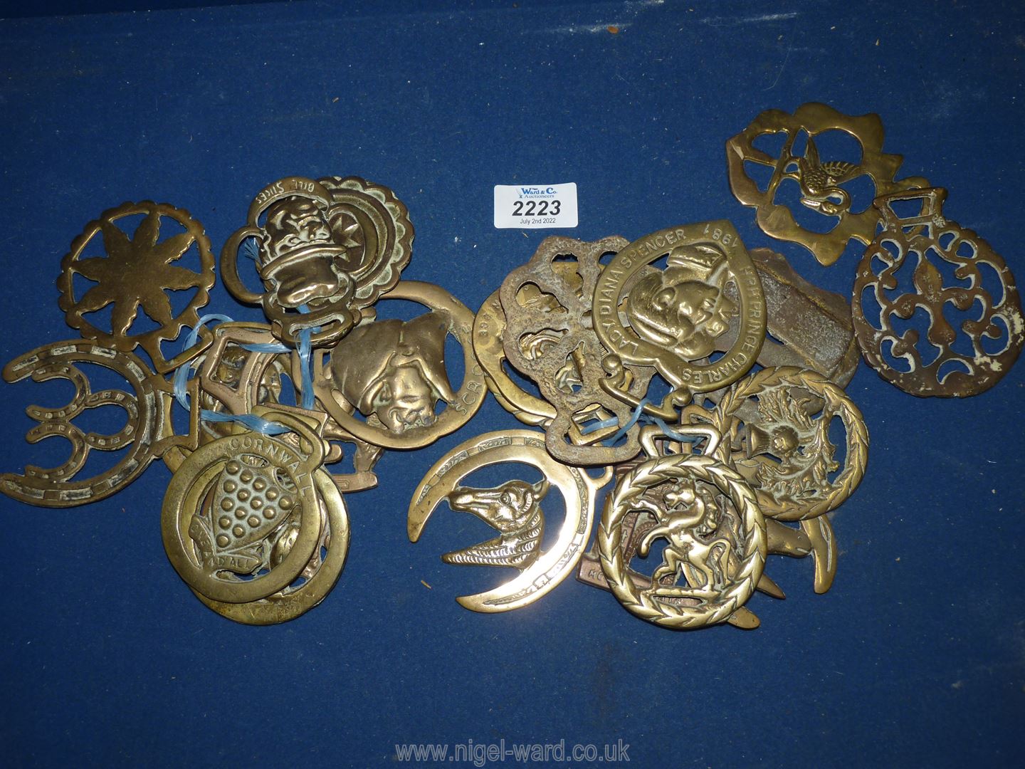 Two bundles of Horse brasses and two loose including Bill Sikes, Llangollen, Stars, Horseshoes etc.