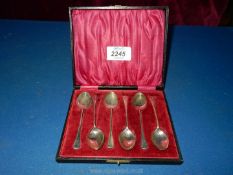 A boxed set of six slim handled Silver teaspoons, Birmingham 1922, maker J.B, 36 gms.