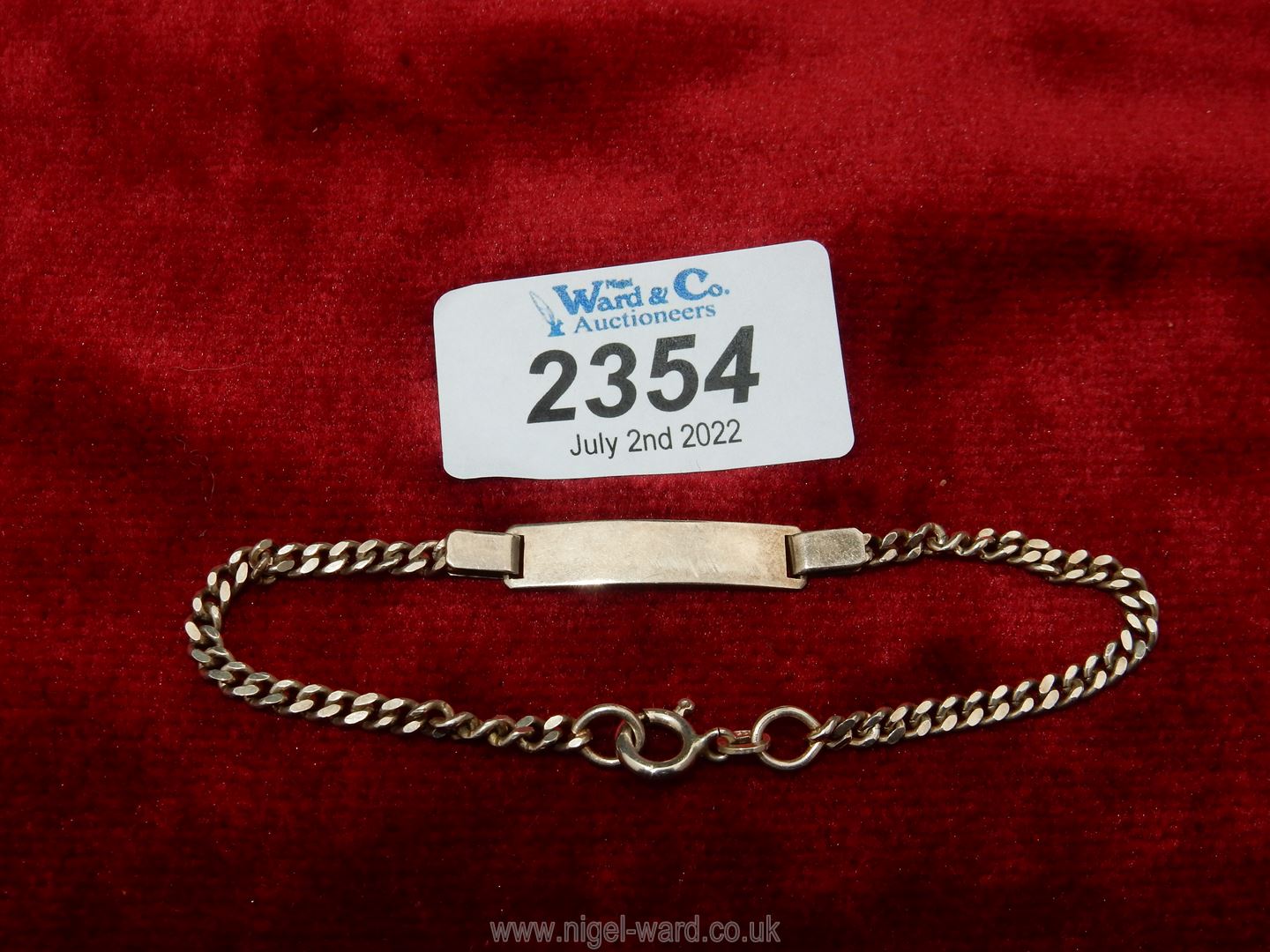 A slim silver Identity bracelet, 7 1/4" long. 5.7 gms approx.