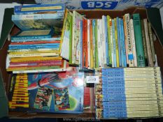 A quantity of children's books including; Enid Blyton, Lady Bird books, Thunderbird Annuals, etc.