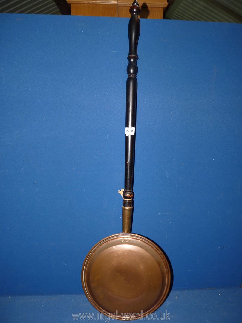 A copper Bed warming pan.