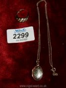 A vintage silver ring set with 18 clear stones, stamped 925, plus an oval locket and chain,