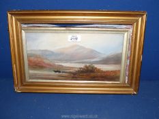 A framed oil on paper depicting a loch scene with boats and mountains in the distance, unsigned,