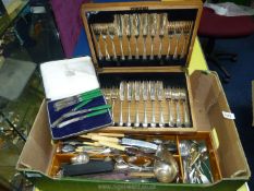 A quantity of plated cutlery including cased set of fish eaters, butter knives, large ladle,