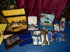 A quantity of boxed cutlery including teaspoons, grapefruit spoons, pastry forks,