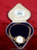 A red presentation cased Sekonda 'Trident' quartz lady's wristwatch with 9 ct gold wristlet and