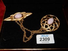 A 'Monet' double brooch with pink marbled effect stone in centre of both.