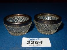 A pair of Silver rimmed salts, Birmingham 1898, maker C.N., possibly C.C. May & Sons.