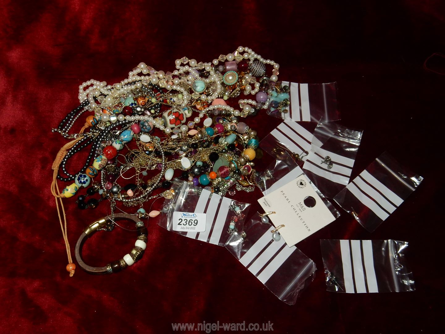 A quantity of costume jewellery, necklaces and earrings.
