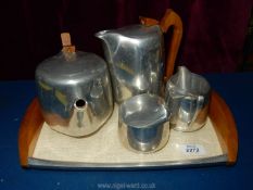 A Picquotware set to include coffee pot, teapot, creamer and sugar bowl on tray.