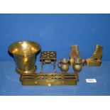 A small quantity of brass including heavy mortar, miniature fire surround and table,