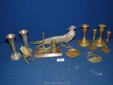 A quantity of small brass candlesticks, two plated vases, plated pheasant,