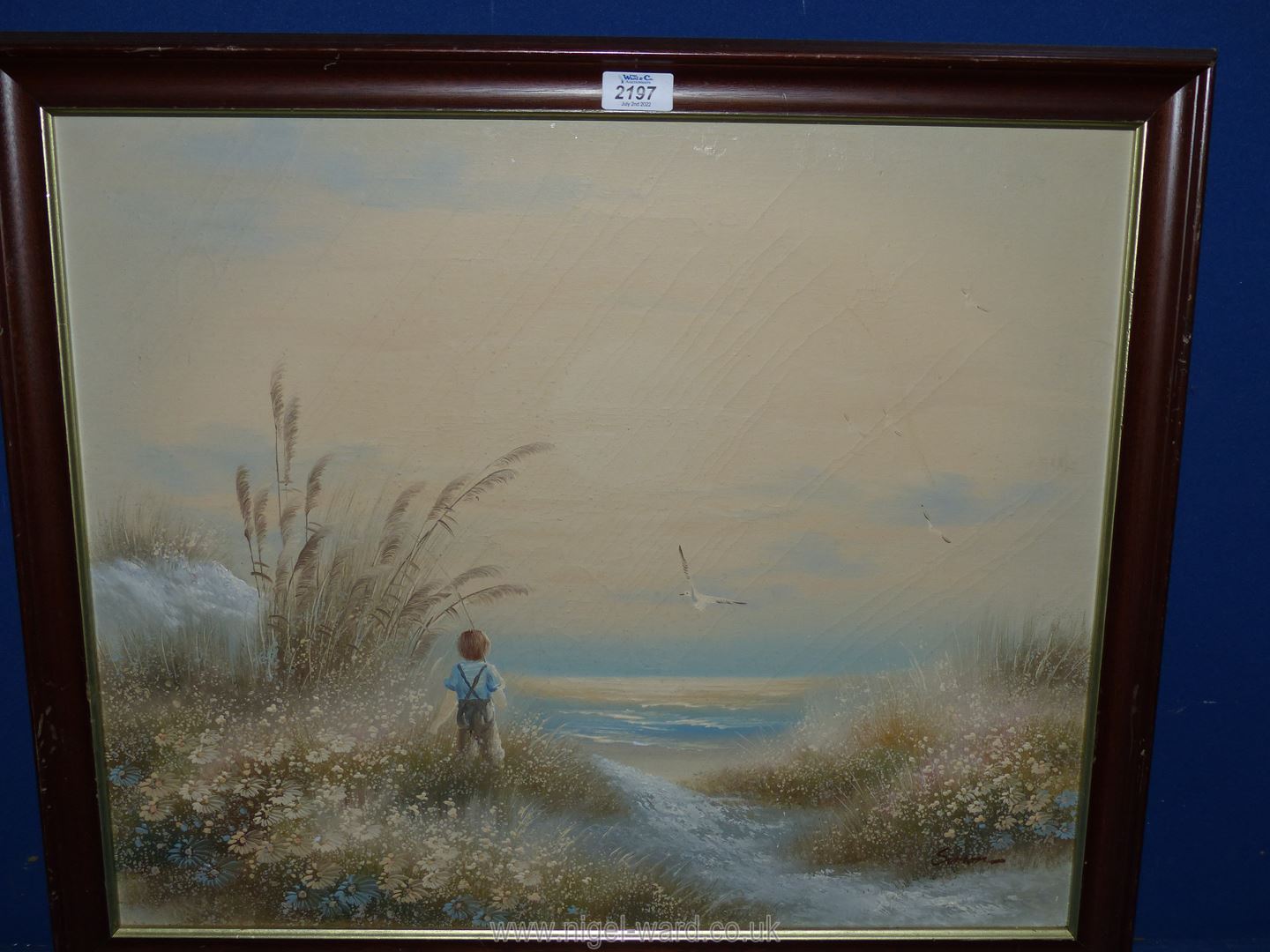 An Oil on canvas depicting a young boy on a beach.