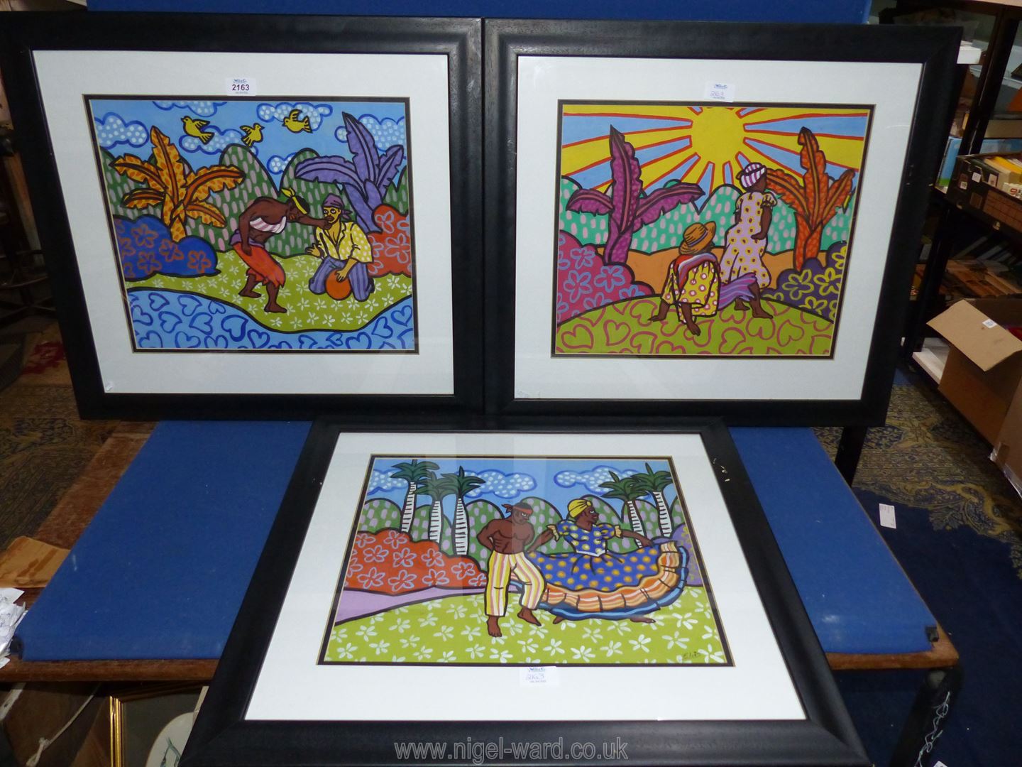 Three black framed Caribbean Watercolours of figures in landscapes, one signed Elvis, - Image 2 of 2