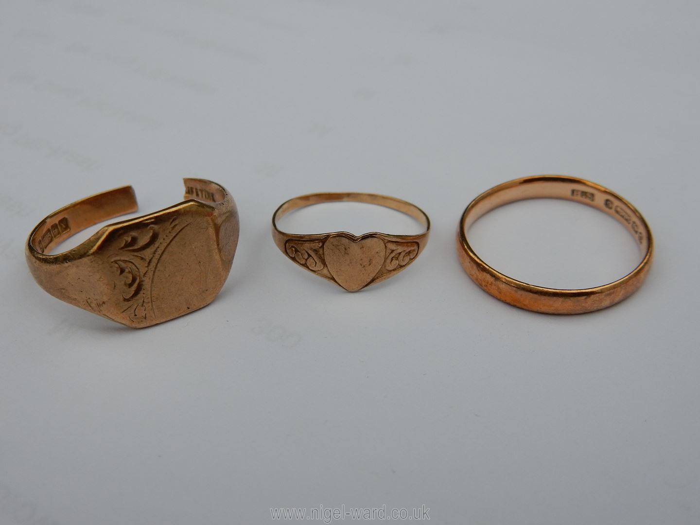 A 9ct. gold wedding band, signet ring (a/f.) and a child's ring. 6.3 gms total, approx.