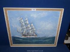 A framed Oil on board depicting a Tall Ship on high seas, signed lower right J.N.E.