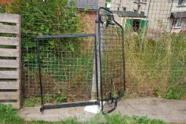 A car dog guard plus a piece of metal framework.