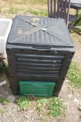 A plastic compost bin.