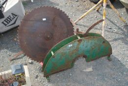 A circular saw guard, 28" circular blade, etc.