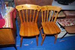 Two pine kitchen chairs.