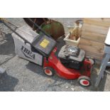 An 'IBEA' petrol mower with grass box.