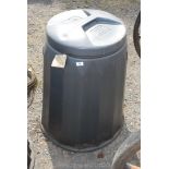 A lidded compost bin.