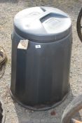 A lidded compost bin.