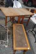 A drop leaf table with 1970's style low coffee table.