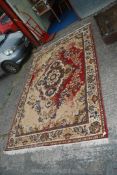 A red and blue coloured carpet (worn) 6' wide x 9 1/2" long.