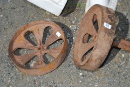 A pair of cast iron wheels.