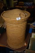 A wicker laundry basket.