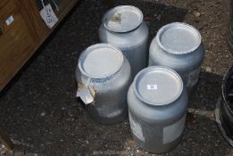 Four aluminium containers for chemicals.