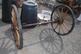 A pair of Cartwheels with wooden spokes, rubber tyres and axle 39" high x 58" wide.