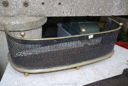 A brass fire fender, 39'' wide x 12'' high x 11'' deep.